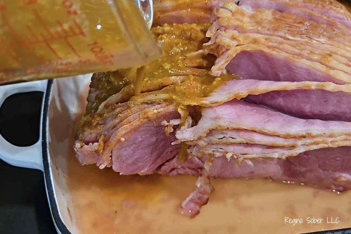 mustard glaze poured on ham