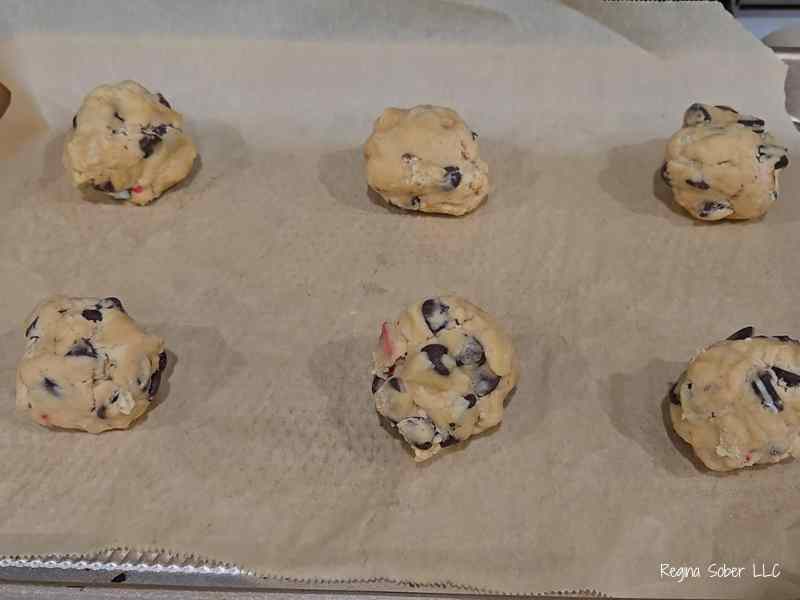 measured cookies on cookie sheet lined with parchment paper