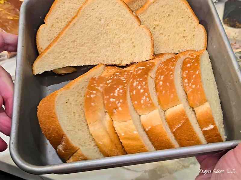 sliced thick bread in baking pan