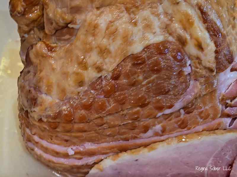 uncooked but precooked spiral ham in roasting pan