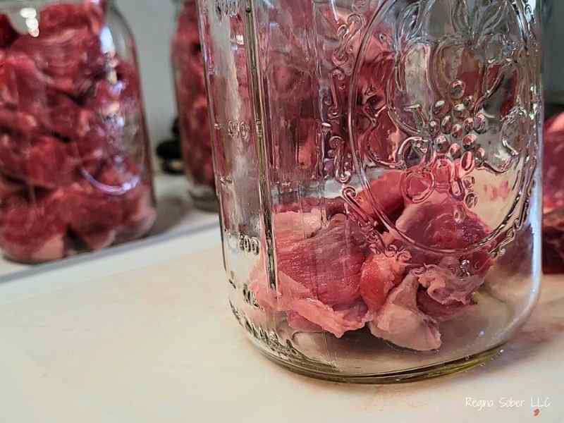 cubed beef in quart jar