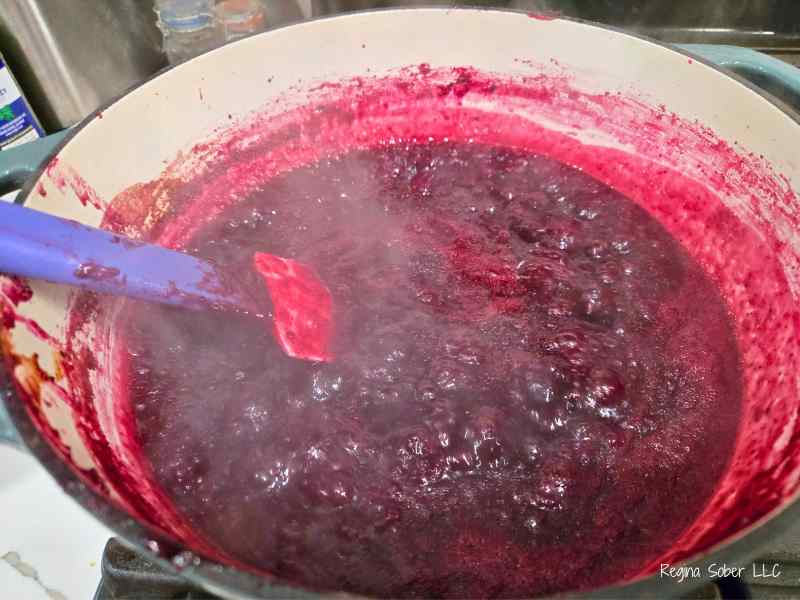 full rolling boil of tri berry jam over medium heat stirring constantly
