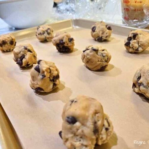 scoops of dough on baking sheet lined with parchment paper