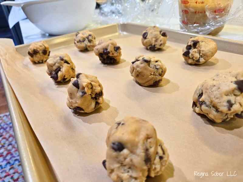 scoops of dough on baking sheet lined with parchment paper