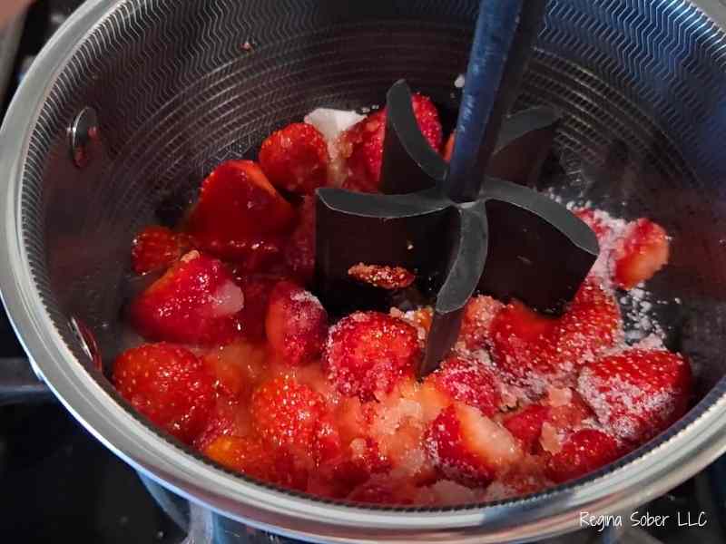 crushed strawberries for smooth syrup