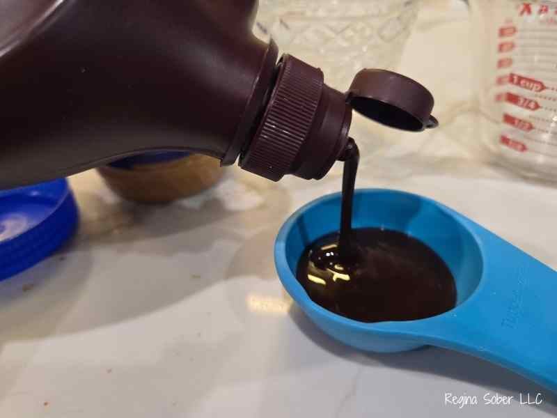 measuring out chocolate syrup