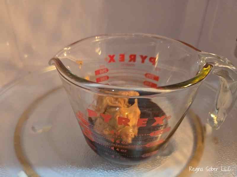 microwaving the ingredients to heat up the chocolate to melt the peanut butter