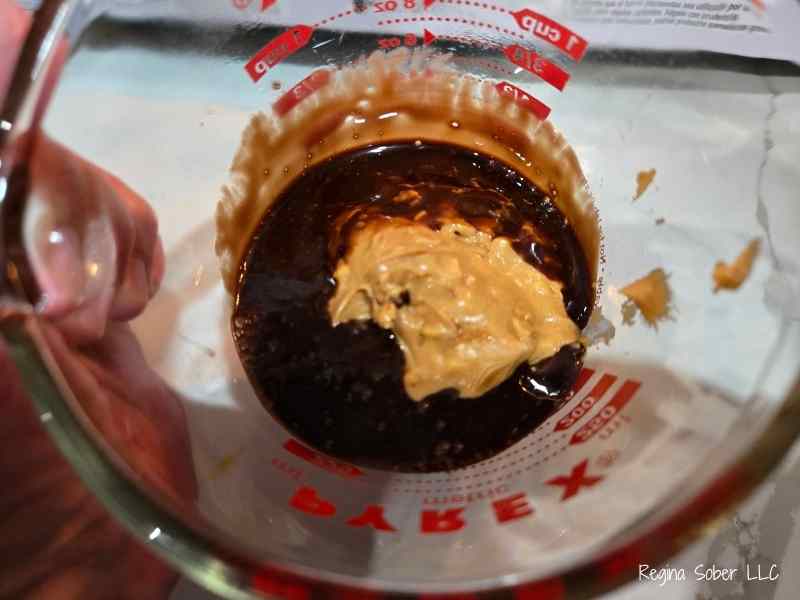 the chocolate sauce will be hot and melt the peanut butter easily.