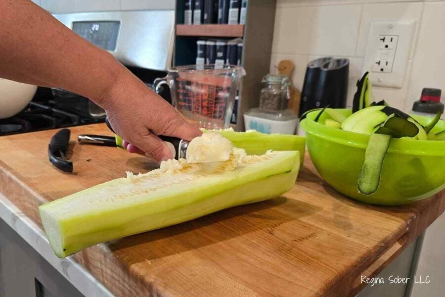 use an ice cream scoop to easily remove the seeds from the zucchini